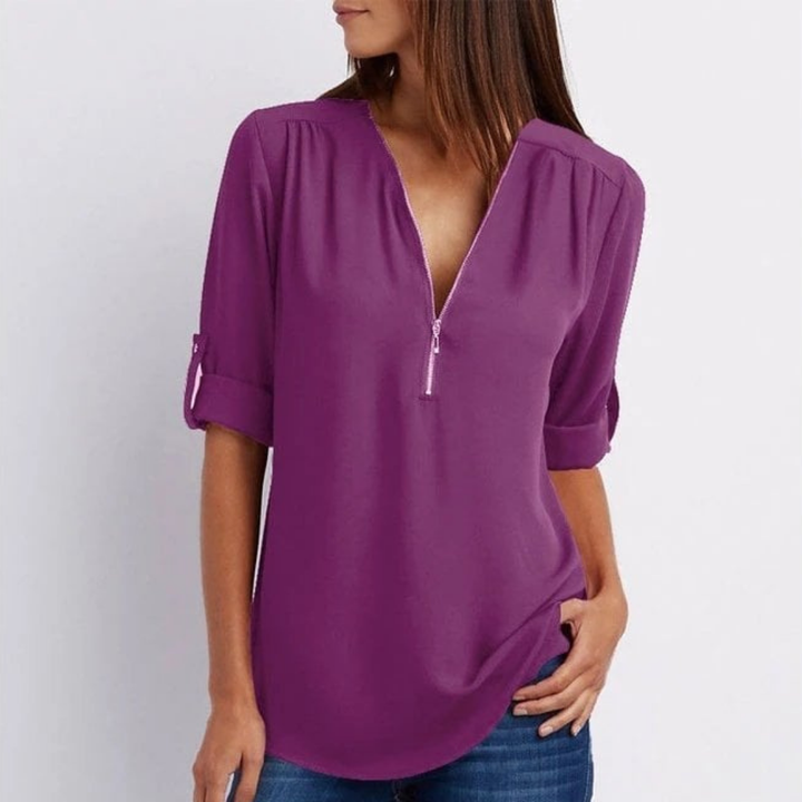 Chic women's V-neck blouse, versatile for office fashion or smart casual events, with comfortable roll-up sleeves.