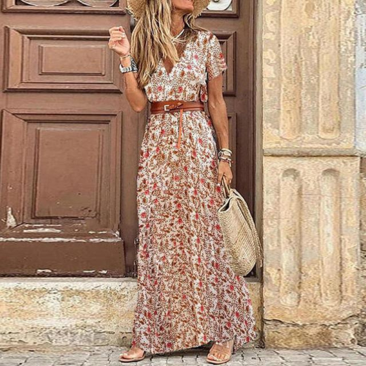 Elegant women's flowy boho floral maxi dress, V-neck, tie waist, ideal for summer and vacation.