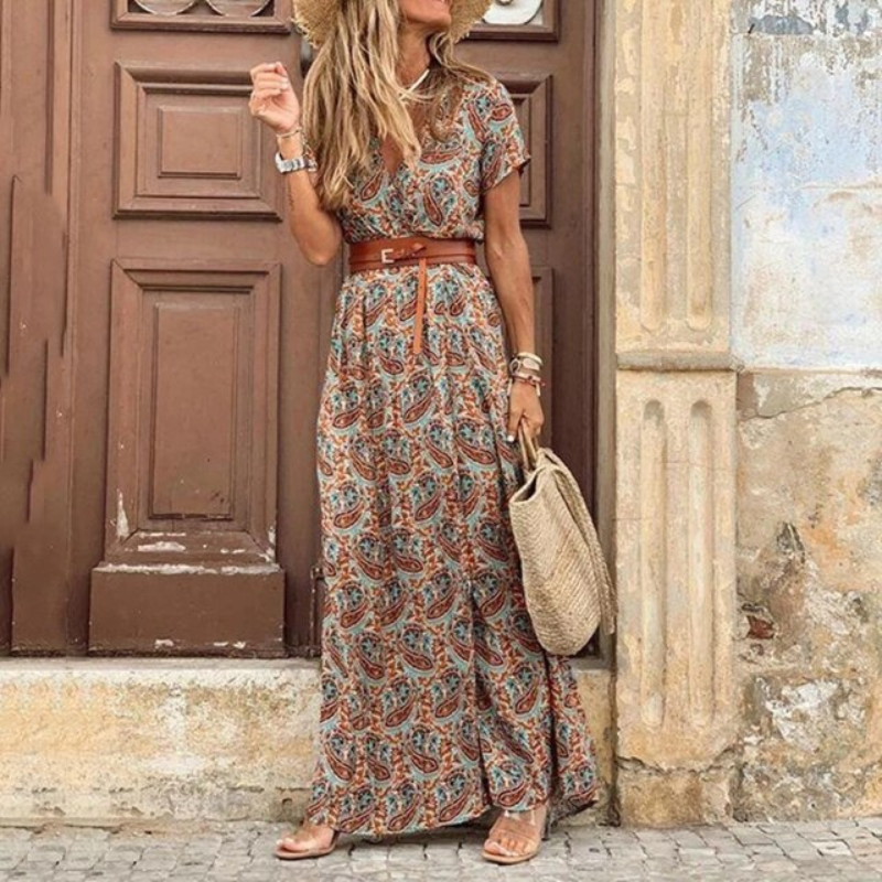 Women's V-neck floral print maxi dress featuring a chic tie waist, ideal for a beach vacation or elegant summer look.