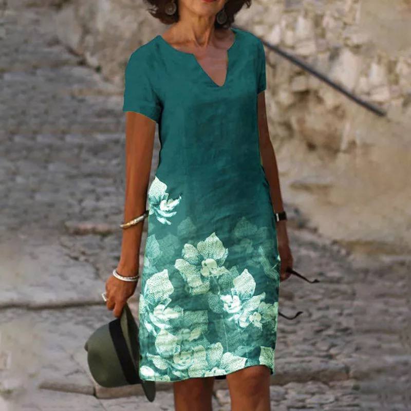 Close-up of a women's v-neck floral print dress, showcasing vibrant pattern and soft fabric, versatile