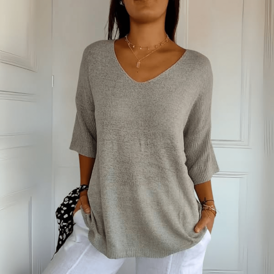 Casual women's V-neck sweater, loose silhouette, three-quarter sleeves. Ideal for fall & spring style.