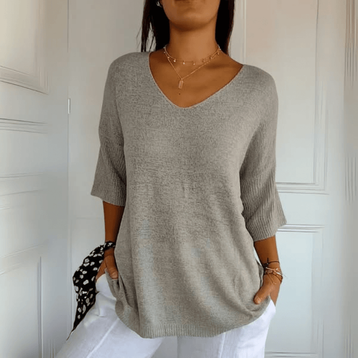 Casual women's V-neck sweater, loose silhouette, three-quarter sleeves. Ideal for fall & spring style.