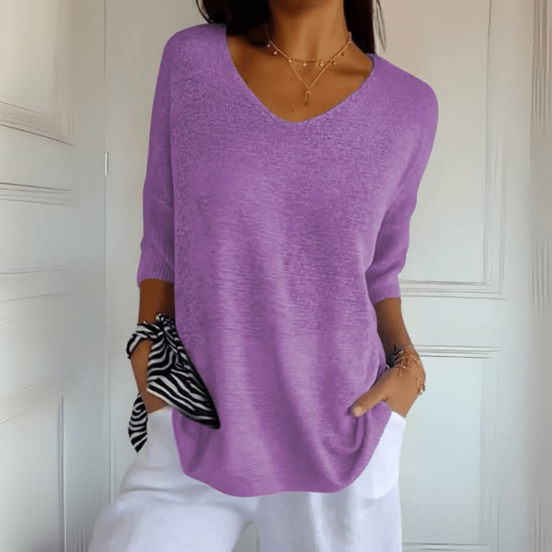 Versatile women's V-neck loose fit sweater with three-quarter sleeves. Perfect for layering and comfort.