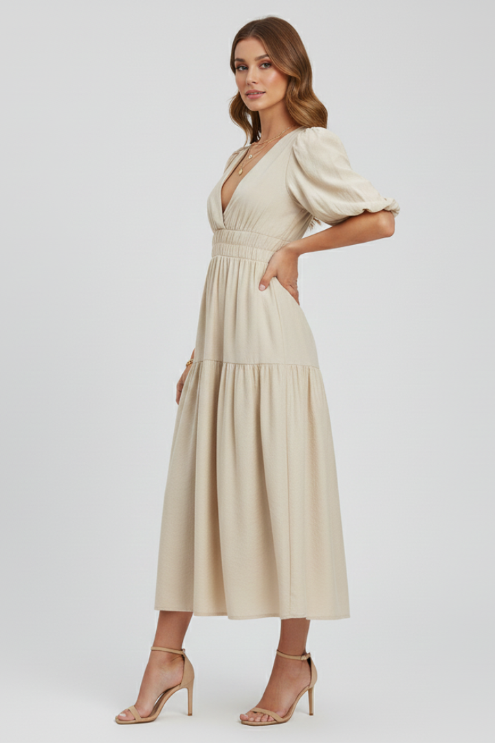 Feminine summer midi dress with a V-neckline, flattering puff sleeves, and a stylish gathered waist.