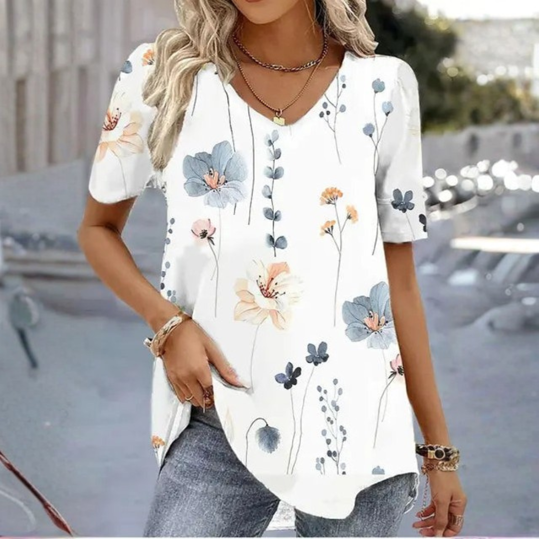 Relaxed fit women's V-neck graphic tee, a stylish printed short-sleeve top for everyday casual wear.