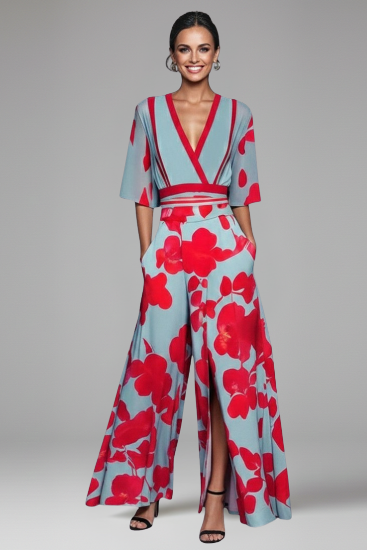 Model poses in a vibrant V-neck printed maxi dress with flutter sleeves & wrap waist, ideal for summer casual wear.