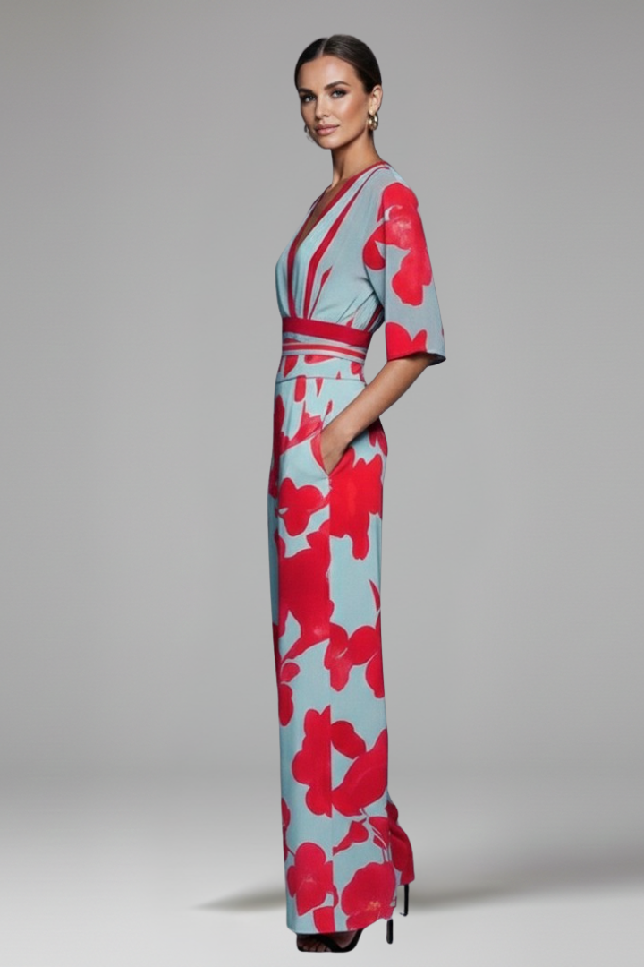 Full-length view of a women's V-neck printed maxi dress, showcasing the elegant flowy skirt & delicate flutter sleeves.