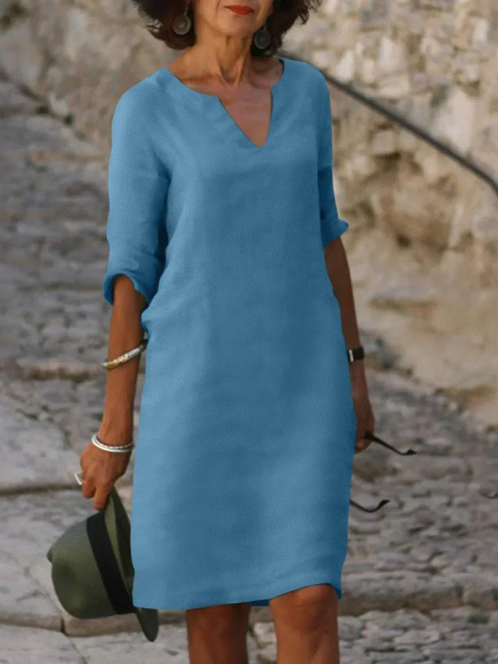 Beautiful women's v-neck midi dress, three-quarter sleeves. Relaxed fit, perfect for summer casual elegant.
