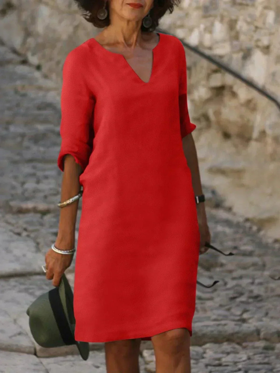 Women's v-neck midi dress, three-quarter sleeves, relaxed fit. Casual elegant everyday dress with pockets.
