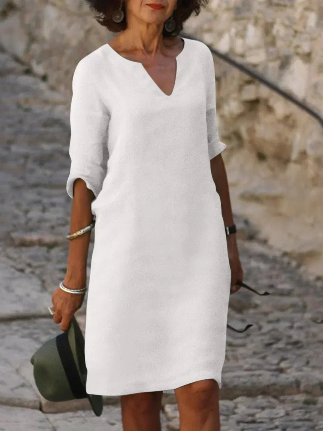 Stylish women's v-neck midi dress, three-quarter sleeves, relaxed fit. Comfortable for summer & travel.