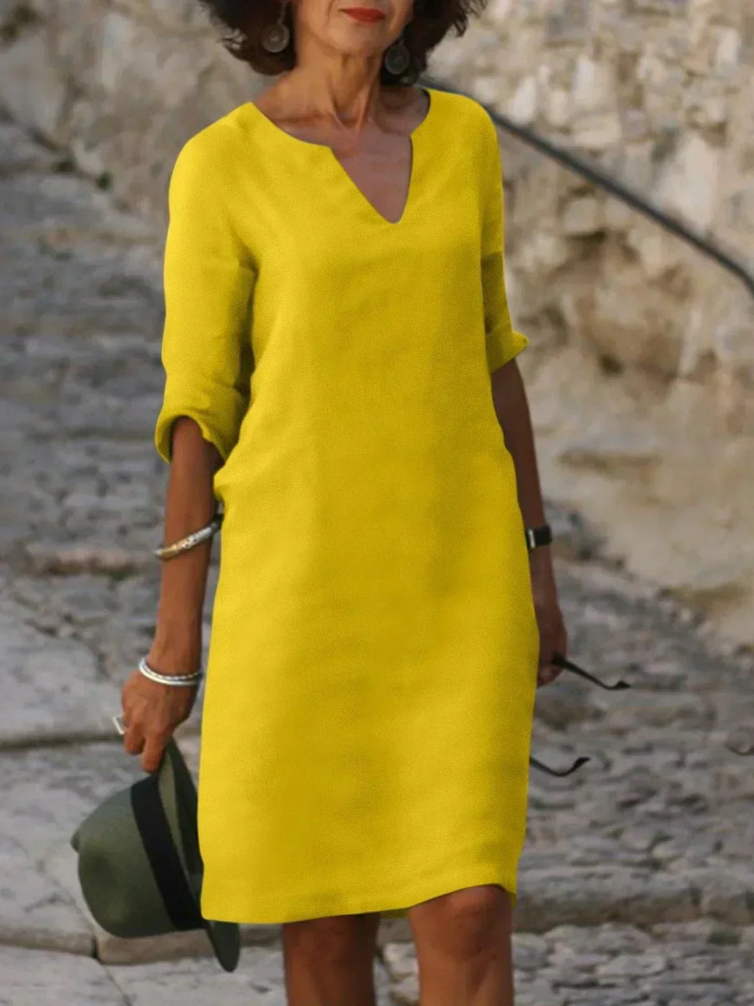 Relaxed fit women's v-neck midi dress, three-quarter sleeves. Ideal for casual elegant day to night style.