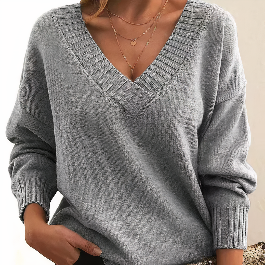 Women's long sleeve V neck ribbed sweater. Relaxed fit, versatile for fall, winter, casual wear.