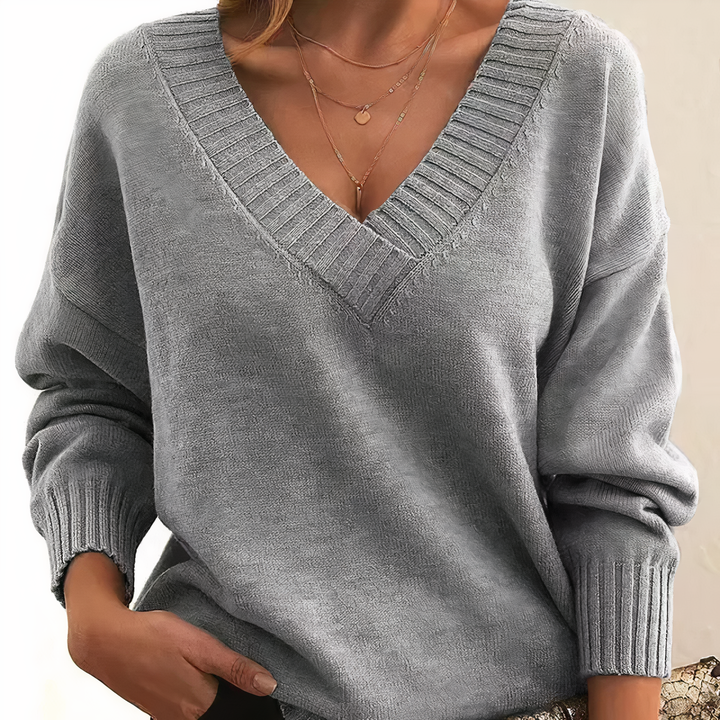 Women's long sleeve V neck ribbed sweater. Relaxed fit, versatile for fall, winter, casual wear.