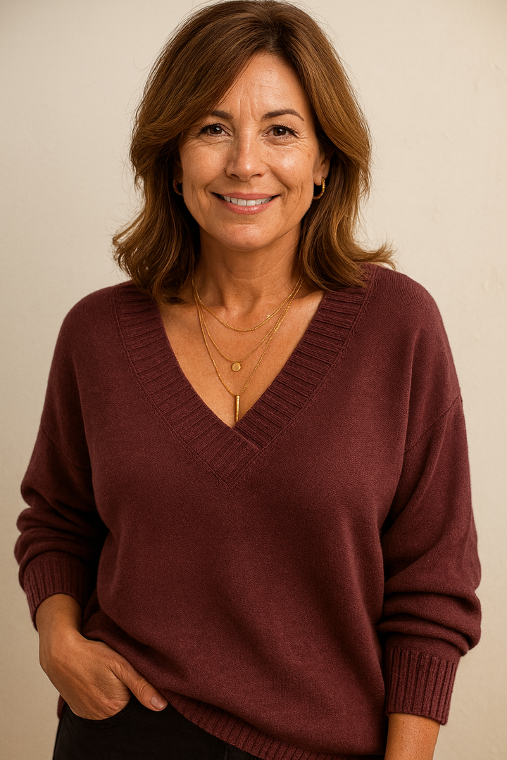 Women's V neck ribbed sweater with a relaxed fit. Long sleeve, perfect for fall/winter casual elegance.