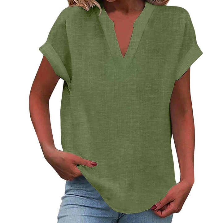 Ladies V-neck short sleeve blouse, relaxed fit, essential for versatile everyday fashion.