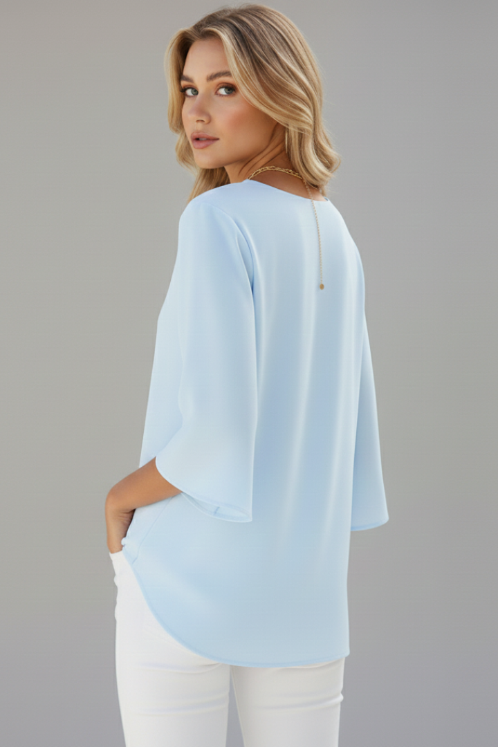 Elegant women's V-neck short sleeve blouse, loose fit for summer or office. Versatile everyday fashion top.