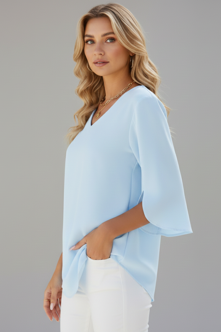 Fashionable women's V-neck top with short sleeves, loose fit for ultimate comfort. Versatile summer blouse.