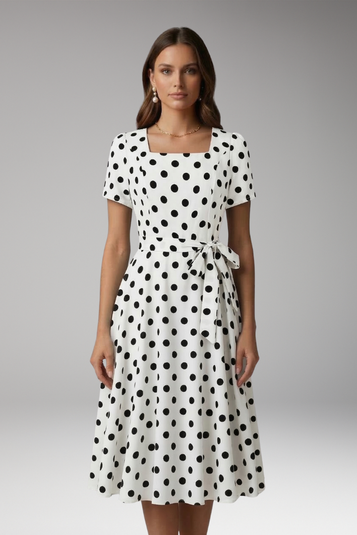 Versatile summer V-neck flared dress for women, featuring a trendy spot pattern.