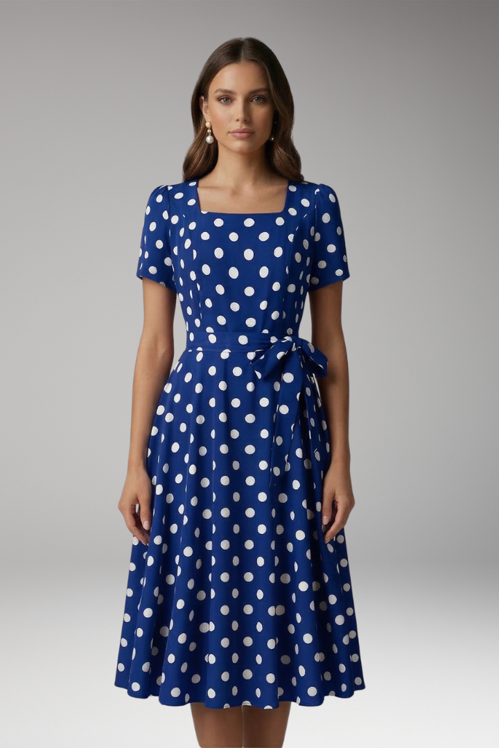 Short sleeve V-neck women's dress with a flattering flared skirt and playful spot pattern.
