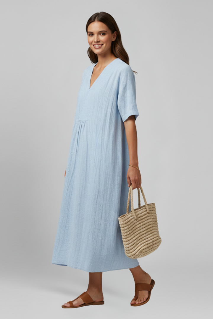 Elegant short sleeve V-neck women's dress, knee-length, with a stylish spot pattern.