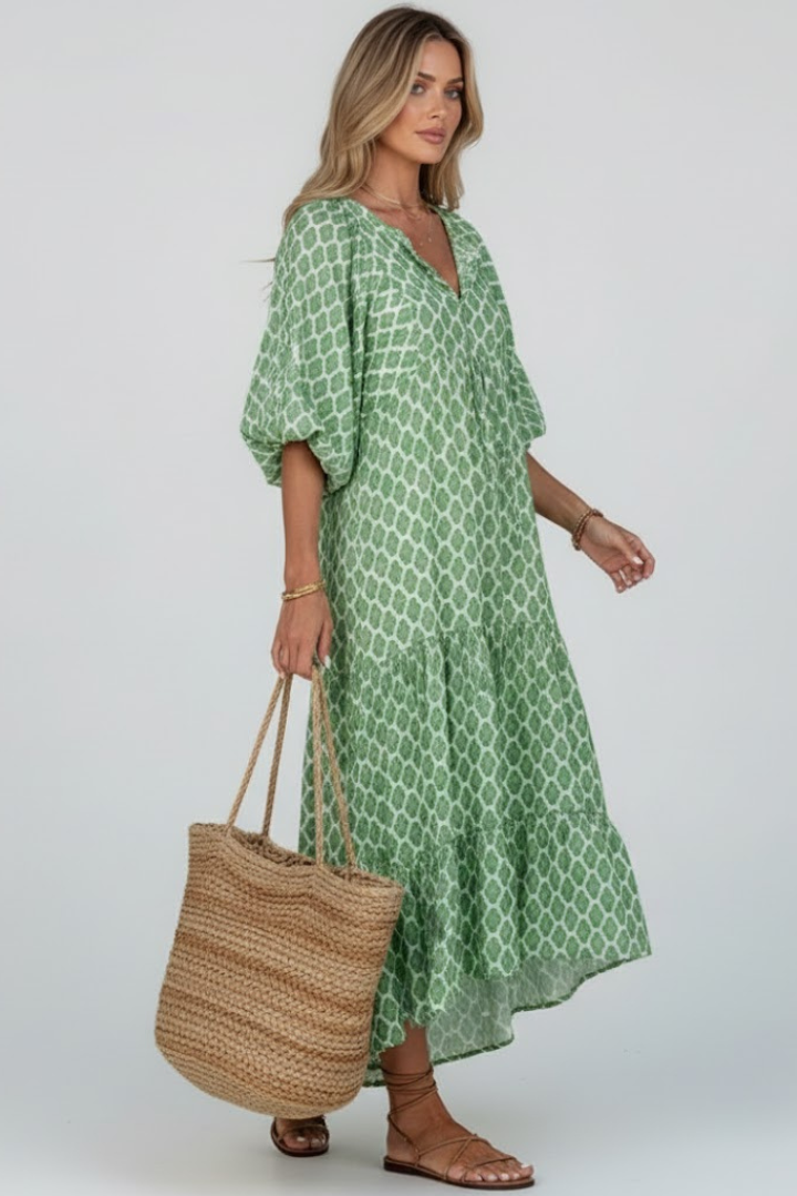 Comfortable women's long V-neck dress with short sleeves and a stylish printed pattern, perfect for casual summer days.