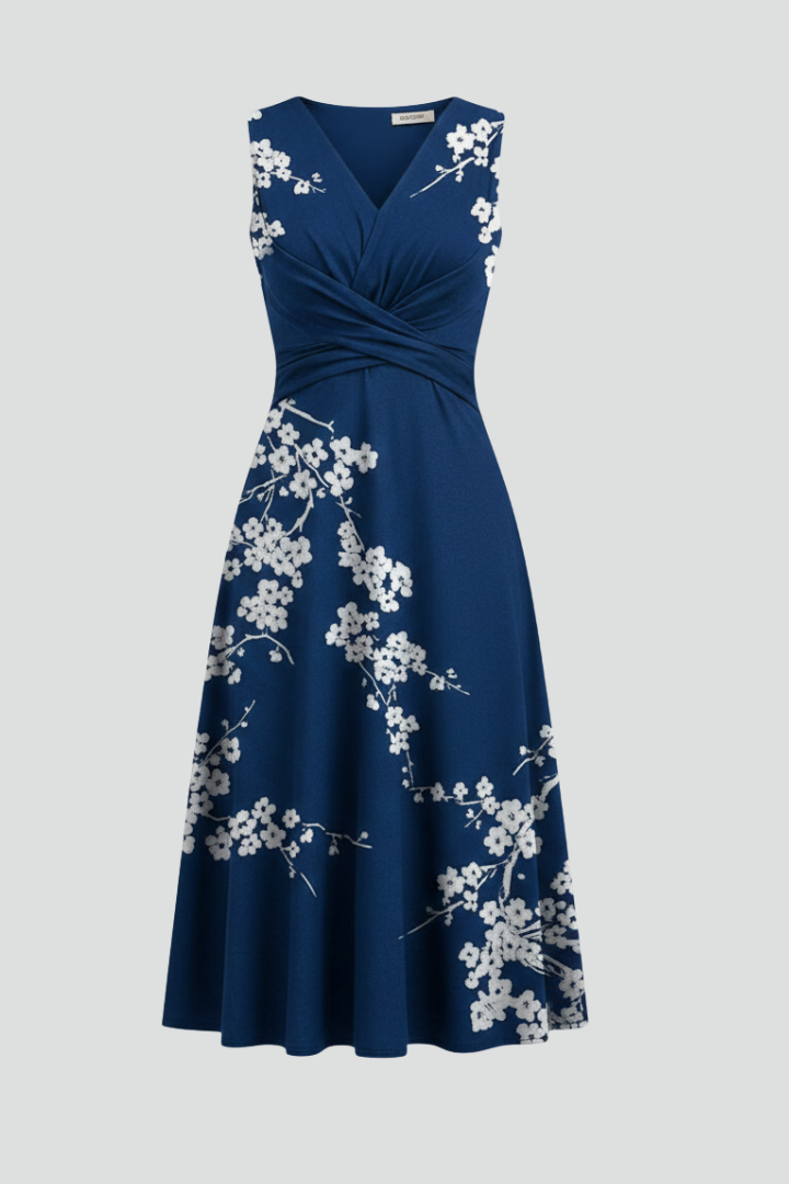 Women's V-neck sleeveless patterned midi dress in light blue, perfect for summer casual elegance.