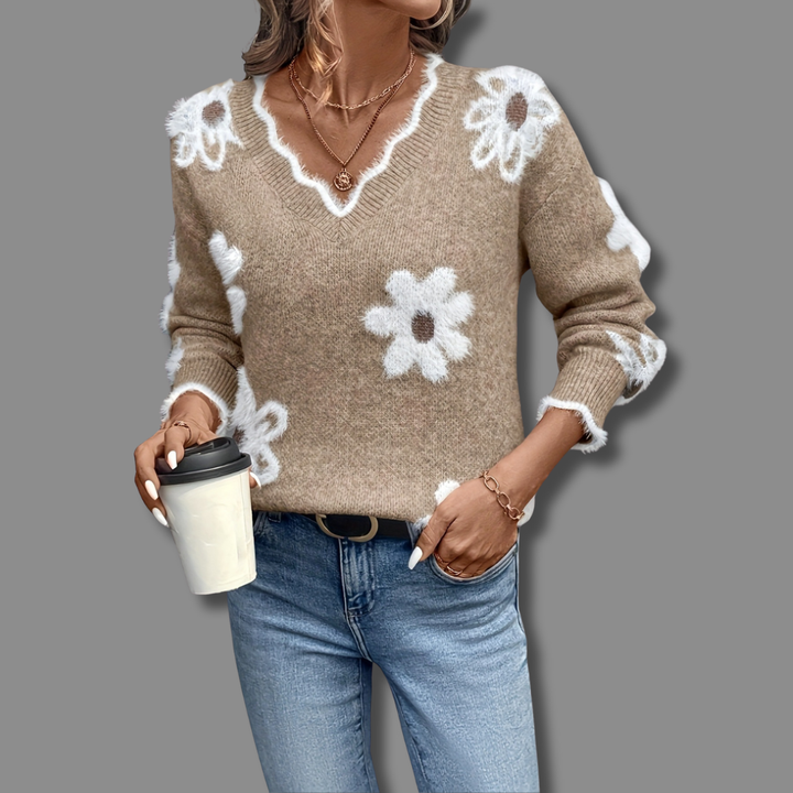 Stylish women's long sleeve v-neck sweater with intricate textured floral details, perfect for spring.
