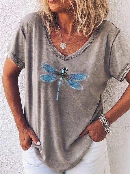 Comfortable women's V-neck tee featuring a stylish dragonfly print. Soft, short sleeve top for everyday relaxed wear.
