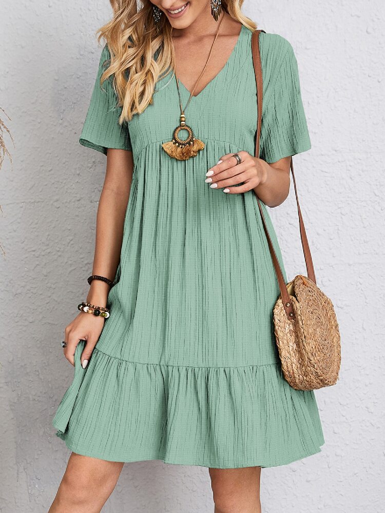 Stylish women's spring mini dress, V-neck, tiered, comfortable & chic.