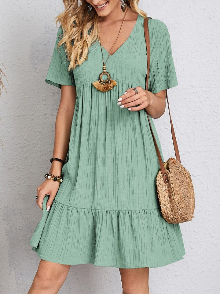 Stylish women's spring mini dress, V-neck, tiered, comfortable & chic.