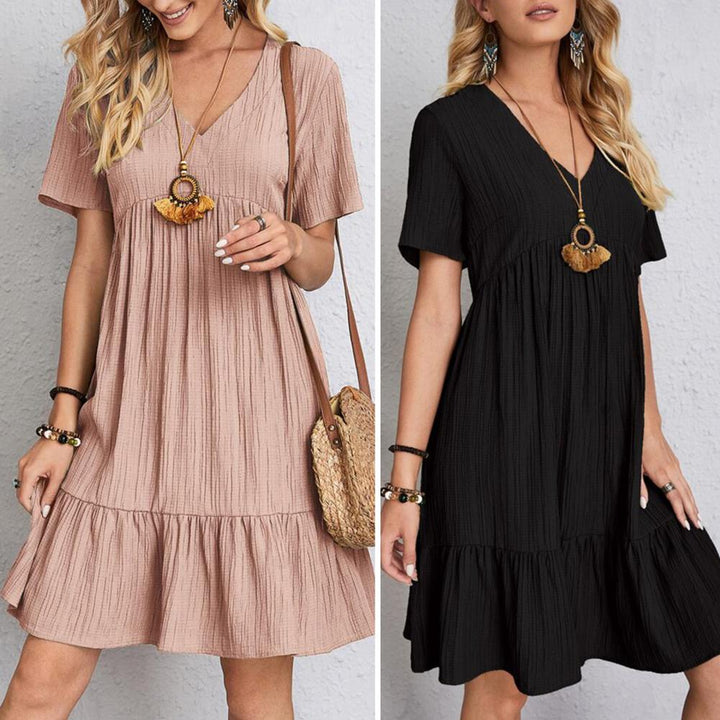 Modern women's mini dress, V-neck, tiered, flowy, casual, and perfect for versatile styling.