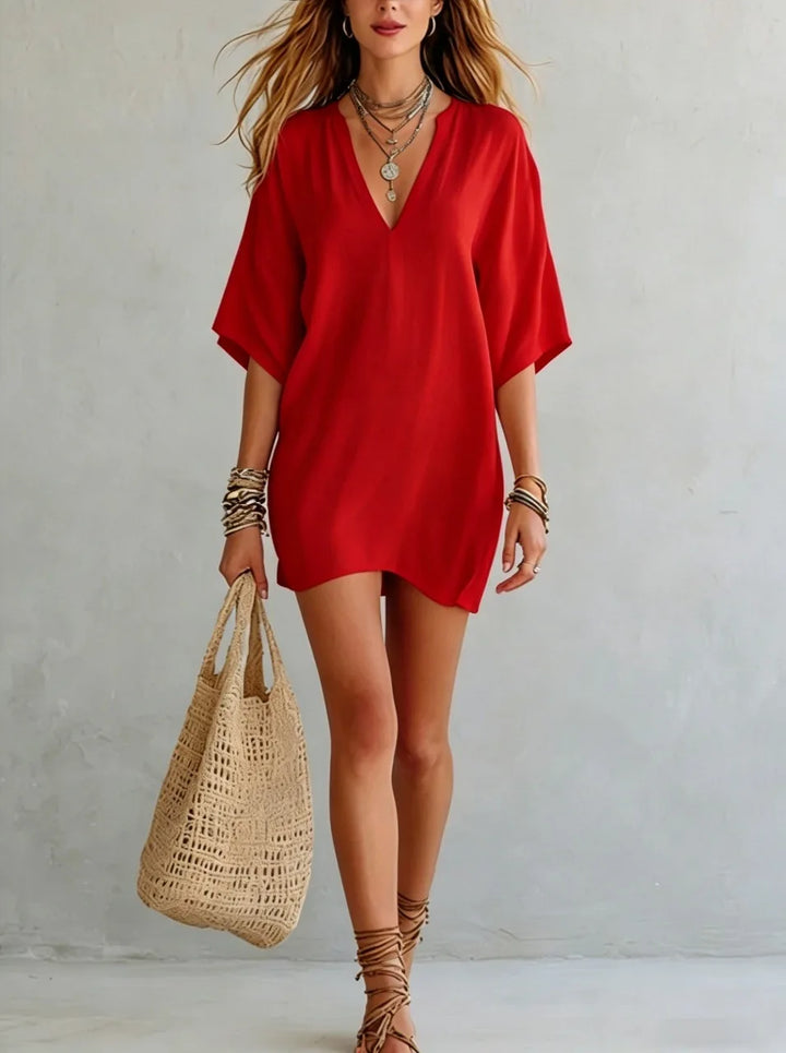 Women's V-neck tunic mini dress featuring a relaxed fit, great for a breezy summer dress or casual everyday style.