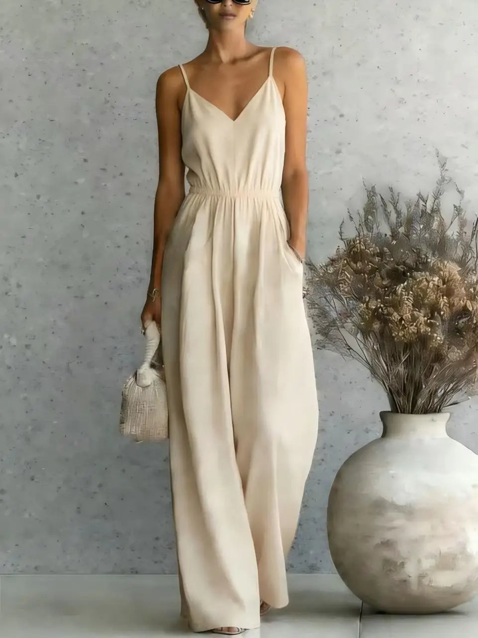 Chic women's V-neck wide leg jumpsuit, a versatile one-piece for casual wear, summer outfits, or vacation style.