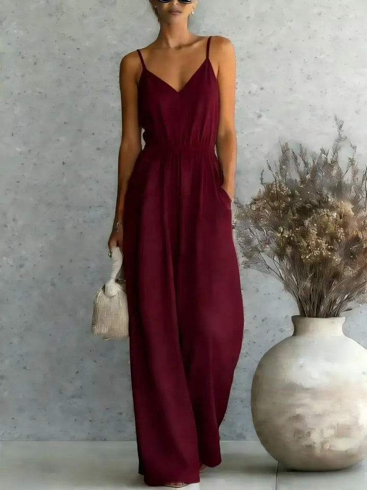 Elegant women's sleeveless V-neck wide leg jumpsuit with a relaxed fit, perfect for warm weather and effortless style.