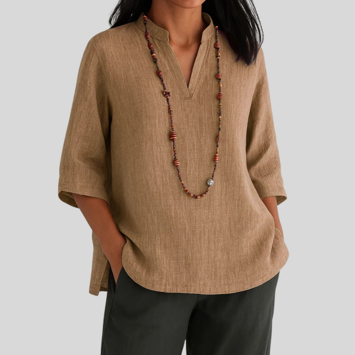 Casual chic women's blouse: V-notch, three-quarter sleeves, rounded hem. Versatile top for daily wear & office.