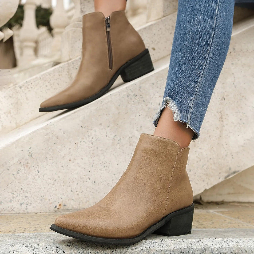 Verona women's leather ankle boots with a modern pointed toe, block heel, and convenient side zip.