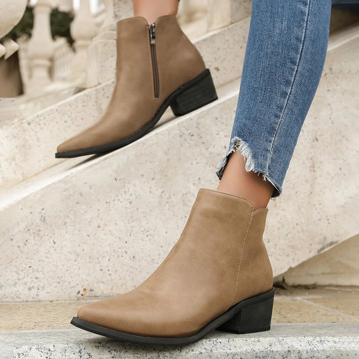 Verona women's leather ankle boots with a modern pointed toe, block heel, and convenient side zip.