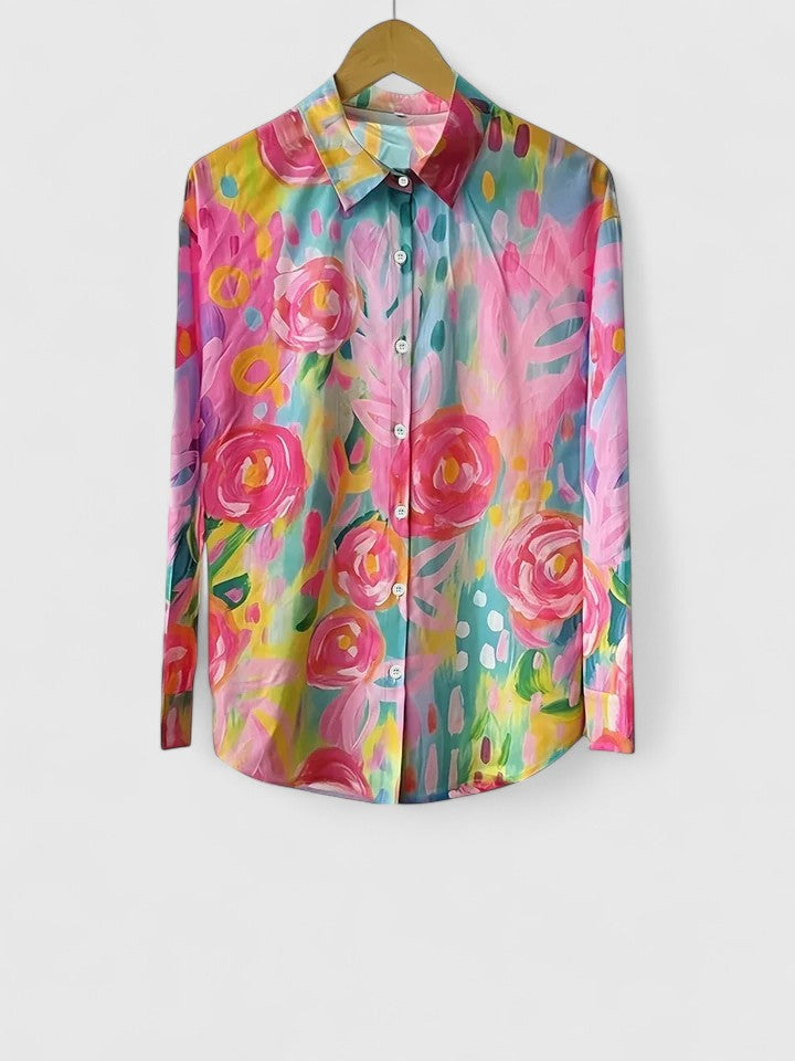 Elegant women's printed blouse, versatile for casual wear or dressed-up occasions. Features a vibrant print.