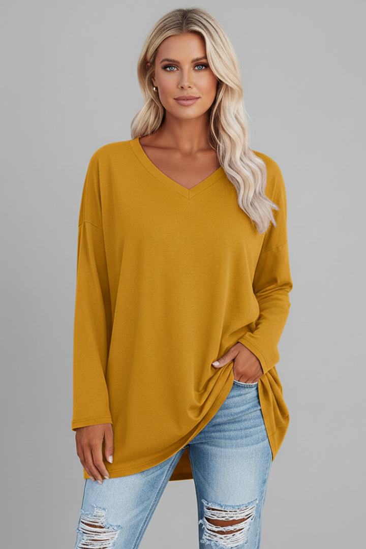 Model wearing a loose-fit v-neck long sleeve top, demonstrating its comfortable and casual style for women.