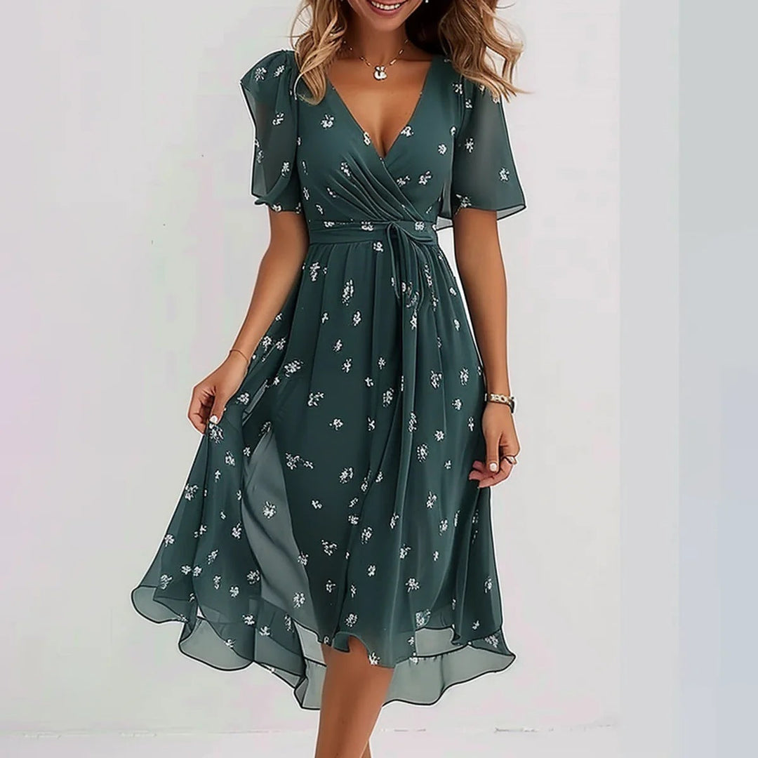 Elegant abstract print midi dress, ideal for parties or sophisticated summer events.