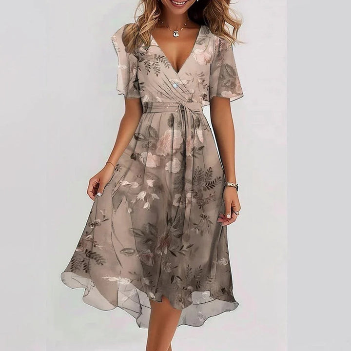 Women's elegant vibrant abstract midi dress, flowy and stylish for summer fashion.