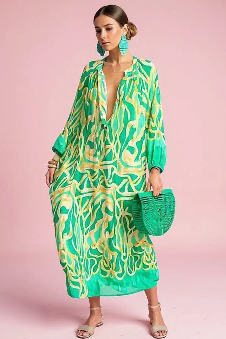 Women's vibrant abstract print V-neck kaftan maxi dress. Relaxed fit, perfect for resort or beach wear.