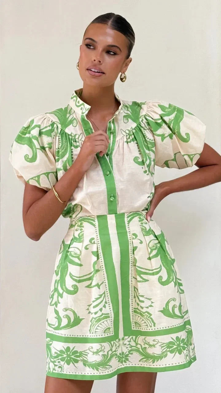 Chic women's cocktail mini dress, floral print, elegant puff sleeves for events.