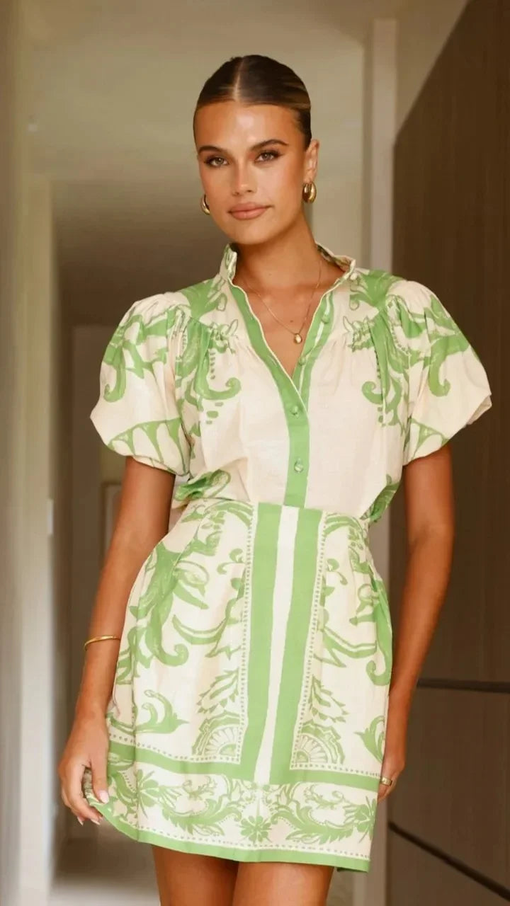 Summer fashion: Women's vibrant floral mini dress with stylish puff sleeves.
