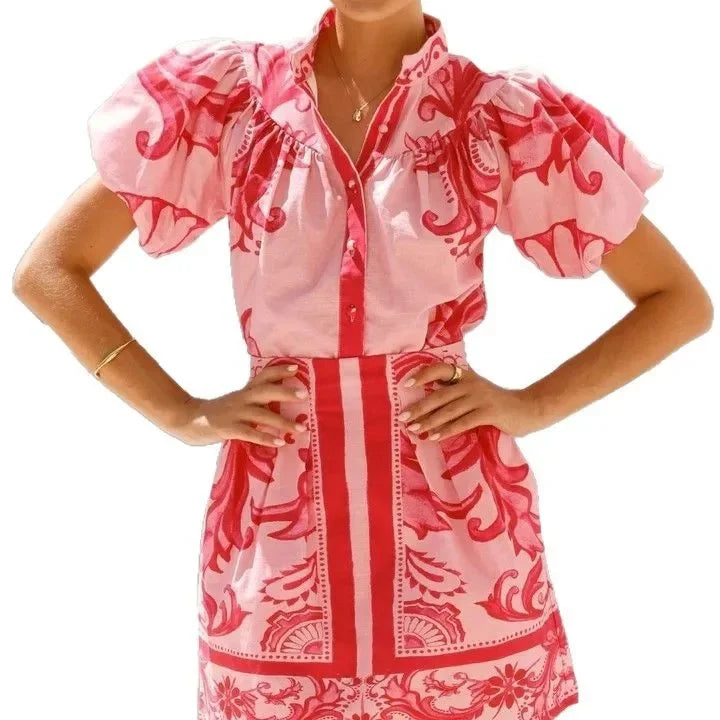 Women's elegant floral mini dress with puff sleeves, a vibrant choice for summer.