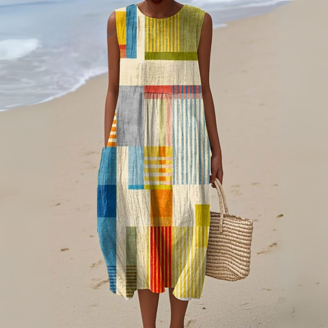 Women's vibrant geometric print A-line summer dress, flowing multicolor sleeveless style for casual chic.