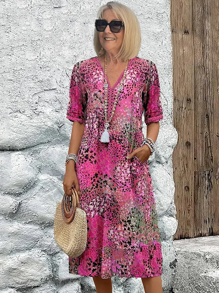Versatile women's vibrant print flowy midi dress. Elegant yet casual, ideal day or evening wear for spring & summer.