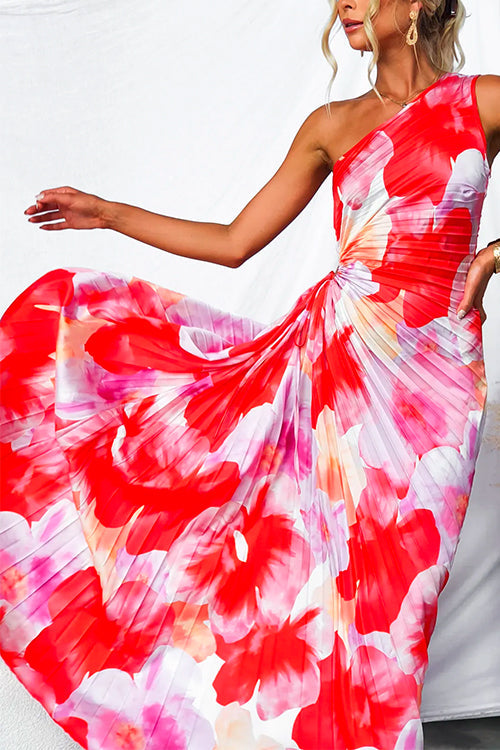 Flowing women's vibrant printed one-shoulder gown, ideal elegant summer dress for wedding guests.