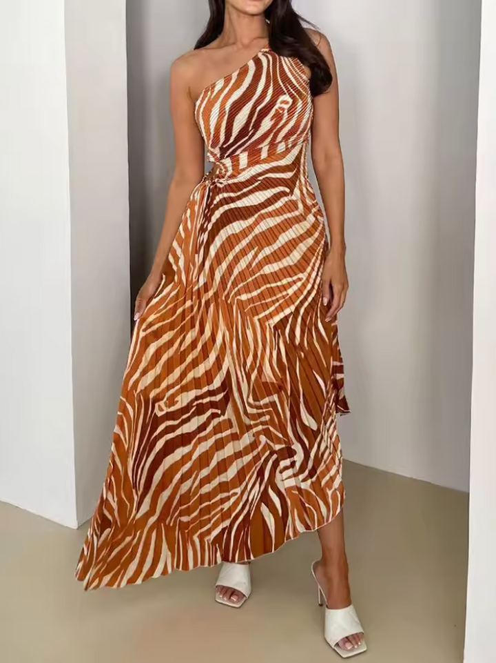 Modern vibrant printed one-shoulder gown, elegant wedding guest dress with stylish asymmetric hem.