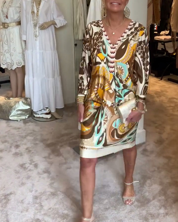 Boho-chic women's tunic dress with a striking sunburst print, ideal for spring resort wear.